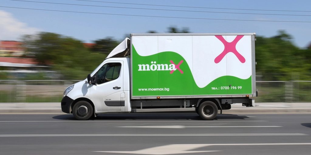 A white van travelling on a road