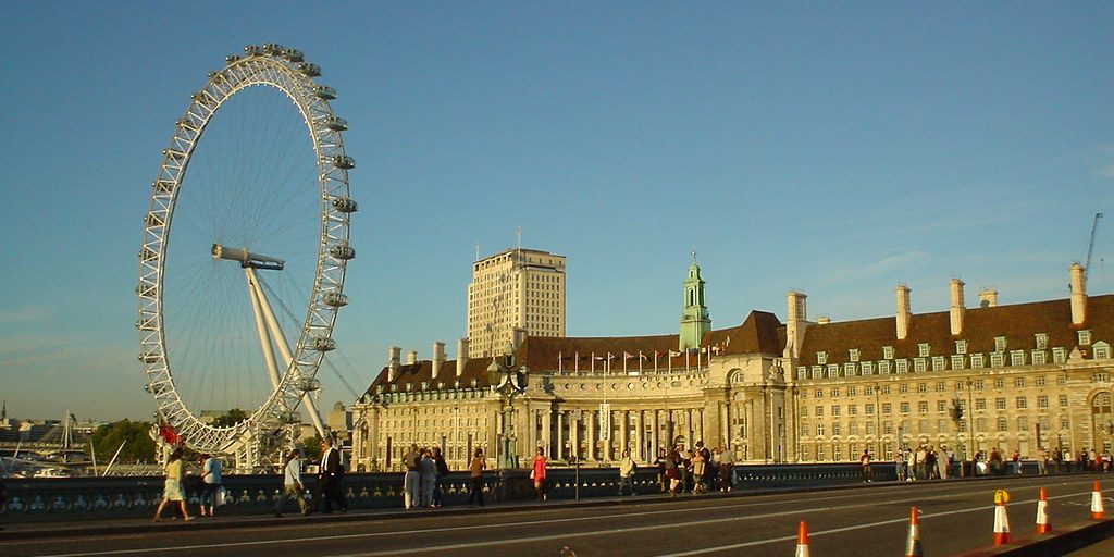 Traffic crossing Westminster Bridge by the London Eye