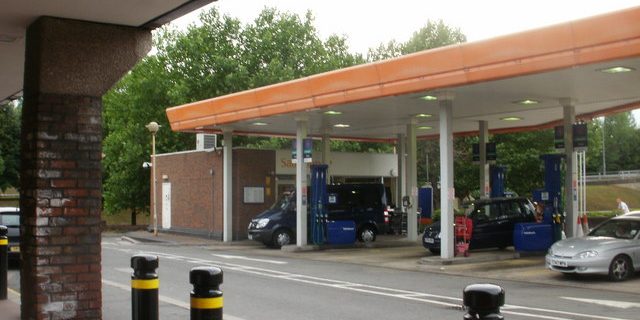 A petrol station forecourt seen from the road