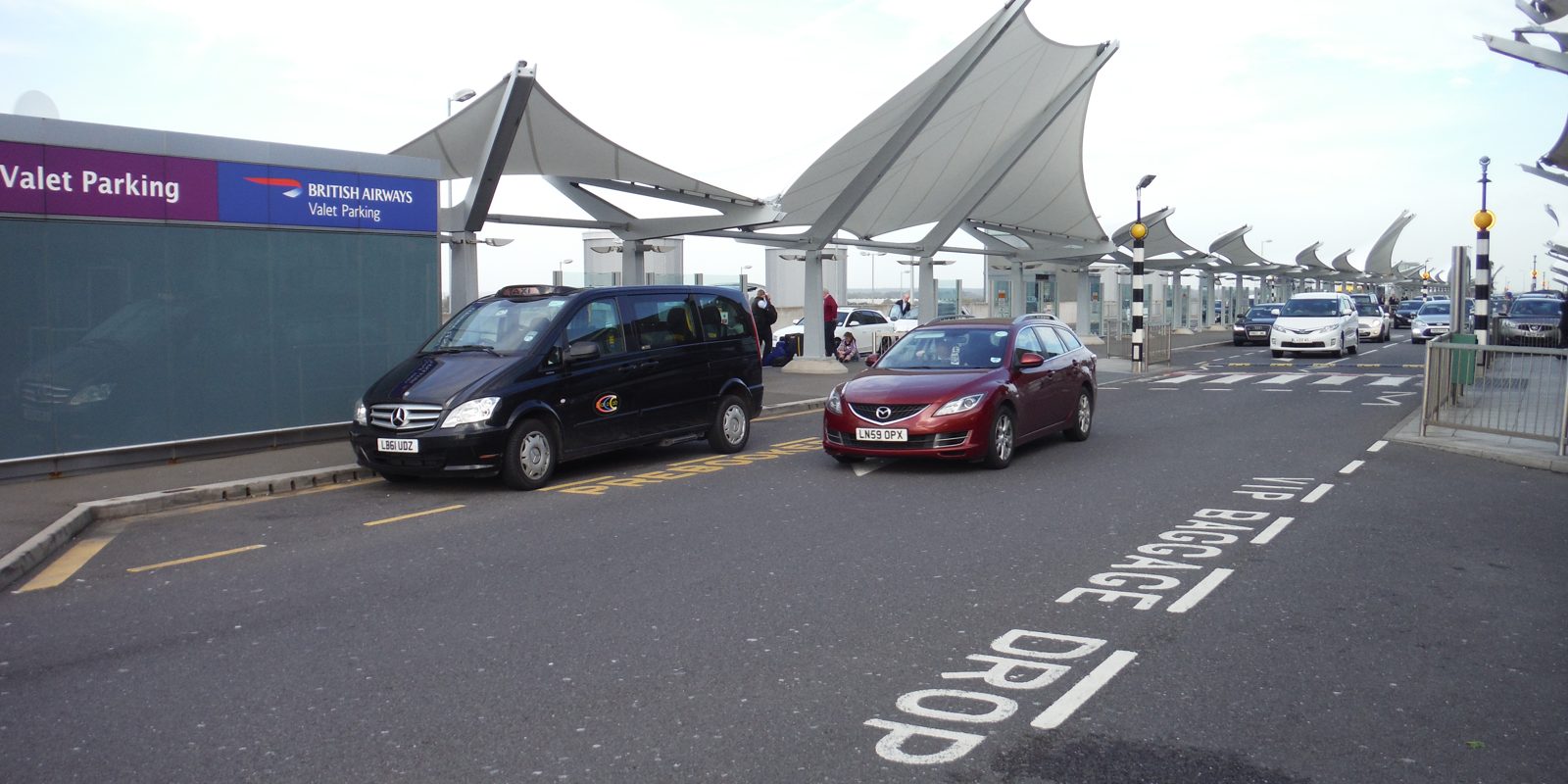 Cars at the drop-off point outside Heathrow Terminal 5