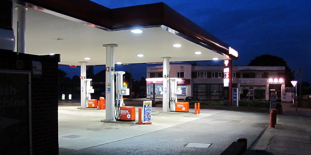 A petrol station forecourt lit at dusk