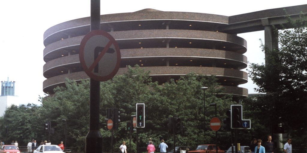 A circular multi storey car park in a city