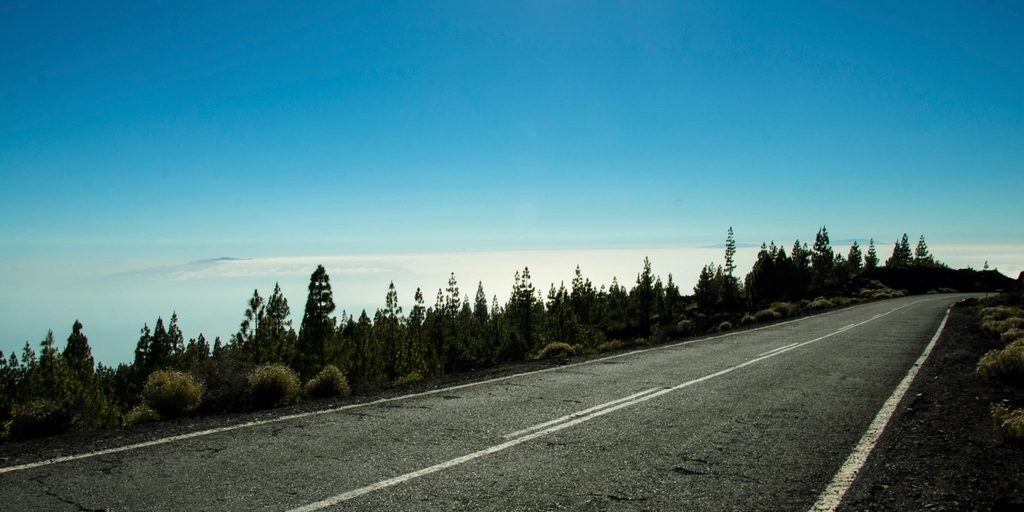 An empty road running to the horizon under a clear sky