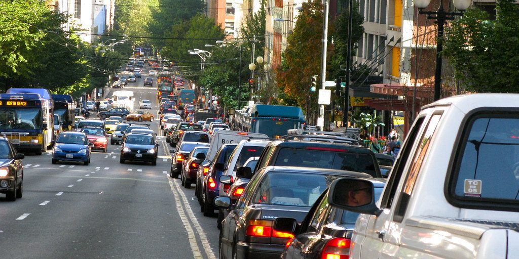 Traffic moving along a busy city street